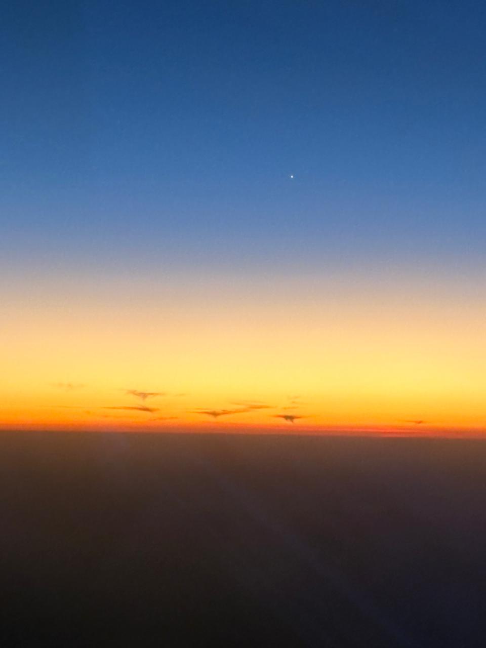 Soft sunrise above the clouds