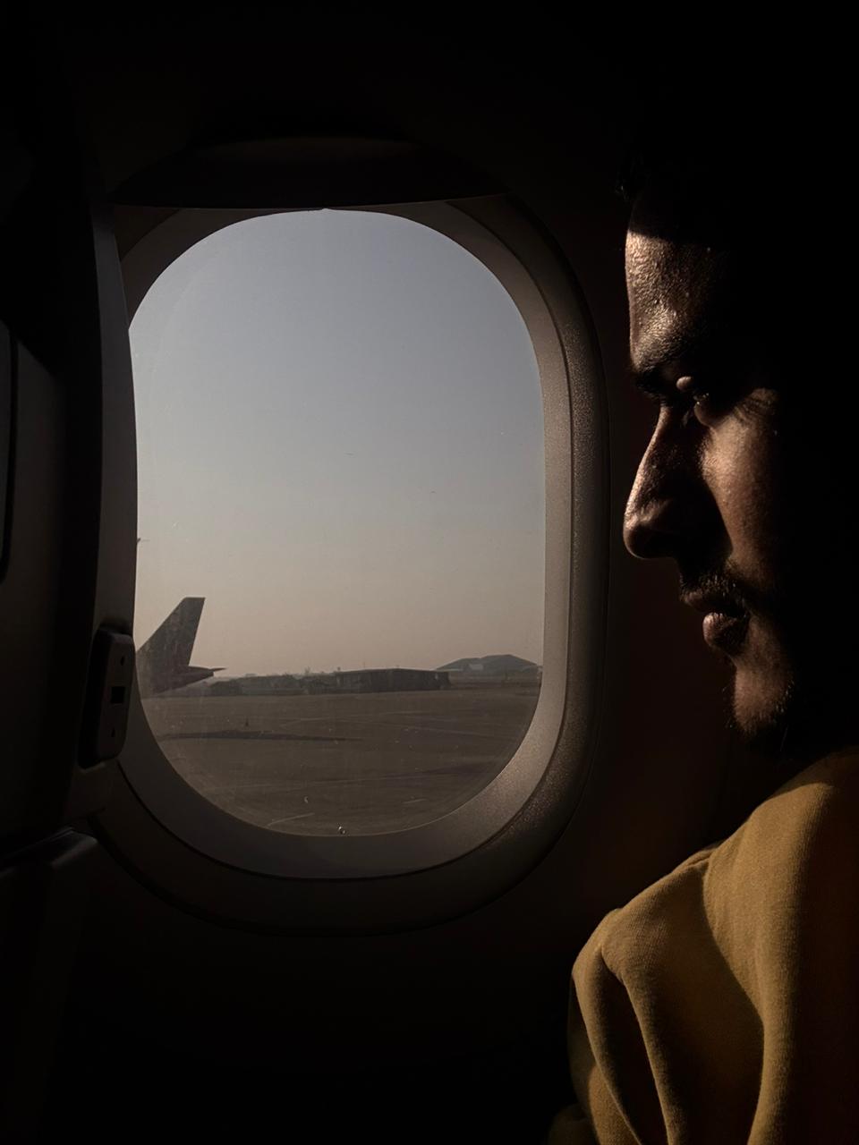 Traveler by the airplane window